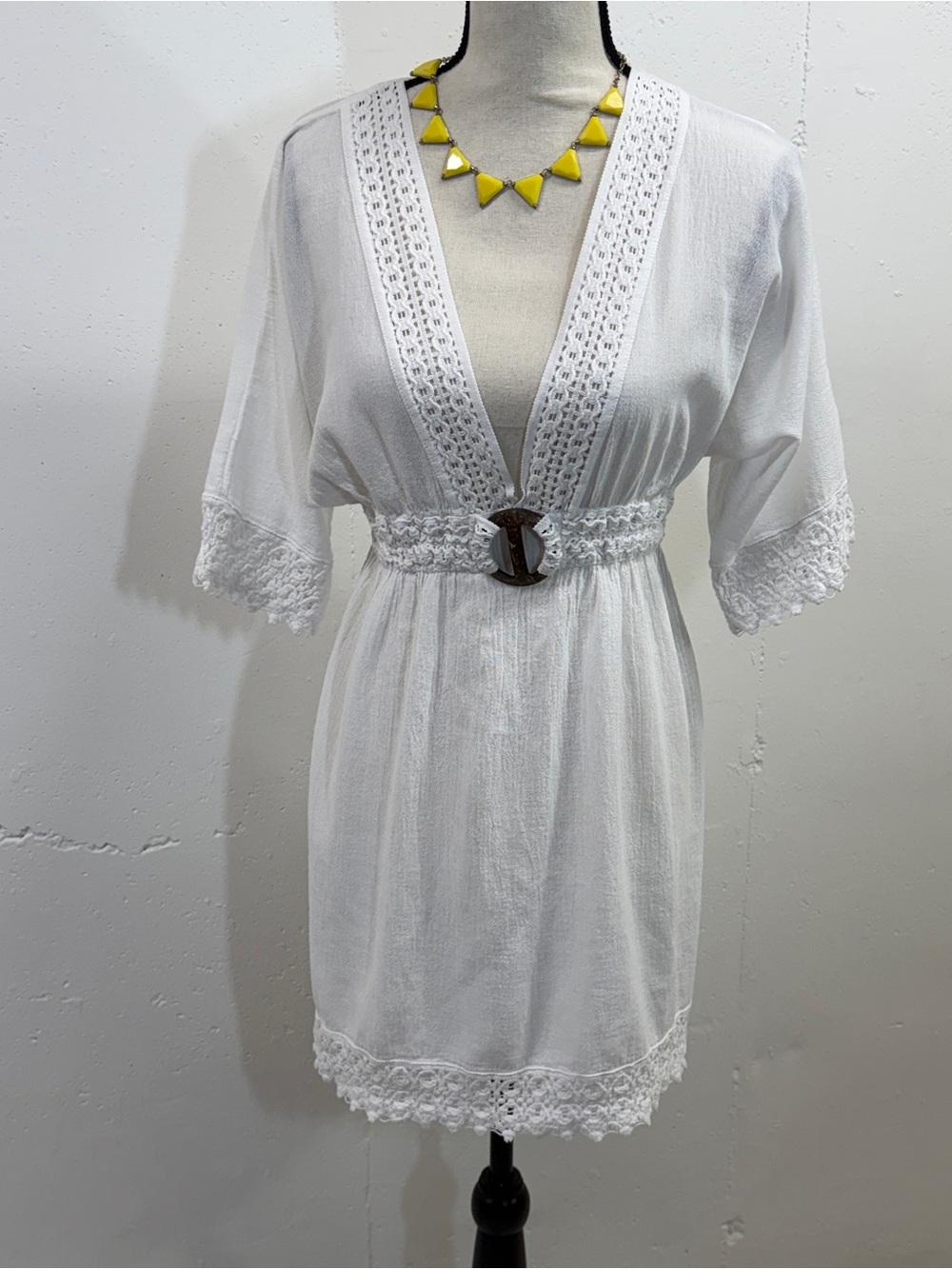 White Crochet Trim V-Neck elastic waist with a wooden ring accent.Beach coverup